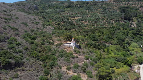 Bucolic-scene-with-small-church-on-hill,-Topolia-Gorge,-Crete
