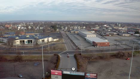 McCoy-Stadium-in-Pawtucket-Rhode-Island,-wide-drone-shot-of-city-around-the-abandoned-stadium,-aerial