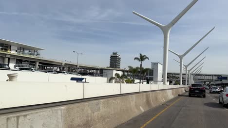 Driving-out-of-Los-Angeles-International-Airport,-POV-on-overcast-day