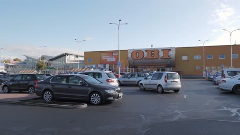 Cars-parking-in-front-of-OBI-hobbymarket-in-Havirov,-Czech-Republic-where-DIY-tools-for-housework-are-sold
