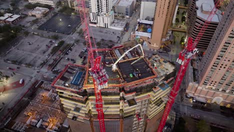 Aerial-view-rising-in-front-of-the-Skanska-1550-on-the-green-Construction-site,-in-Downtown-Houston,-USA