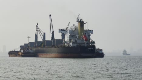 A-large-ship-standing-in-the-middle-of-the-Arabian-sea-near-the-port-of-Mumbai