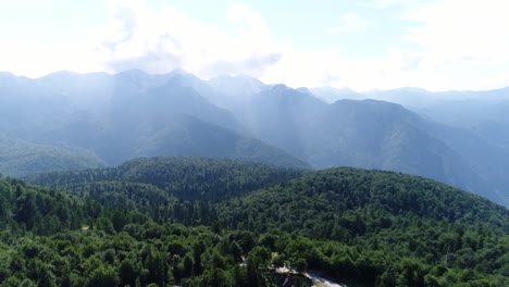 Aerial-Drone-Above-Foggy-Mountain-Vogel-Julian-Alps-Forest-National-Parj-Bohinj-Slovenia,-Scenic-Natural-Landscape