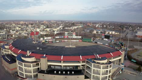 McCoy-Stadium-in-Pawtucket-Rhode-Island,-wide-drone-shot-flying-over-abandoned-stadium,-aerial