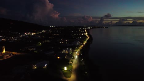 Aerial-view-of-road-along-coastline-at-dusk