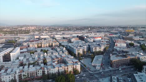 Beautiful-drone-shot-flying-over-Los-Angeles-apartment-developments-at-sunset
