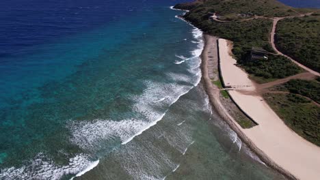 Aerial-View-of-British-Virgin-Islands,-Oil-Nut-Bay-Coastline,-Sea-Waves-and-Coral-Reefs