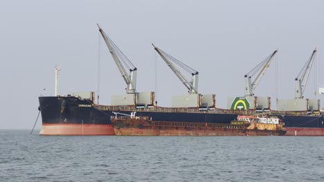 A-shot-of-a-large-anchored-in-the-Arabian-sea-that-is-mounted-with-cranes-that-used-for-loading-and-unloading-of-goods