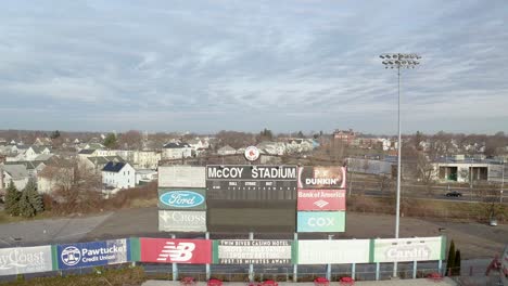 McCoy-Stadium-in-Pawtucket-Rhode-Island,-starting-on-scoreboard-then-revealing-the-abandoned-stadium,-aerial