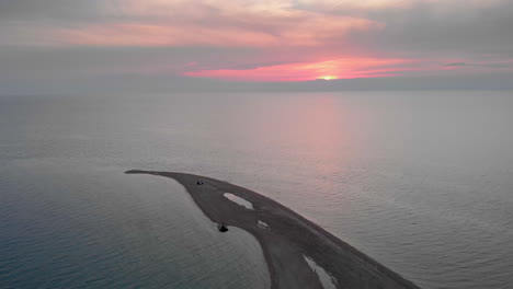 Drone-video-over-empty-beach-sea-sand-cape-sunset-summer-Greece