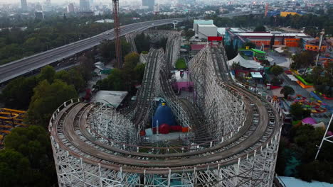 Mexico-City---June-2022:-Flying-over-abandoned-ancient-wooden-rollercoaster-in-the-park-of-Chapultepec