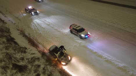 Aerial-shot-of-a-car-accident-at-a-snow-covered-highway
