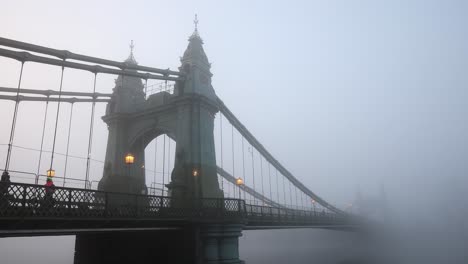 Commuters-crossing-Hammersmith-Bridge-on-a-foggy-winter-morning