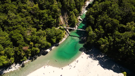 Aerial-drone-shot-of-Blue-Pools-New-Zealand-surrounded-by-trees