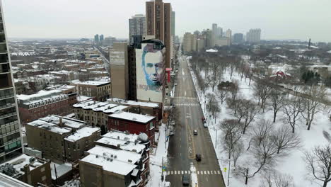 Drone-shot-approaching-President-Lincolns-picture,-snowy-day-in-Lincoln-park,-Chicago,-USA