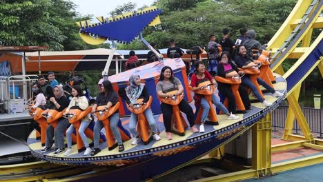 Indonesia,-Feb-8-2023-:-people-are-very-happy-to-play-at-the-Saloka-playground