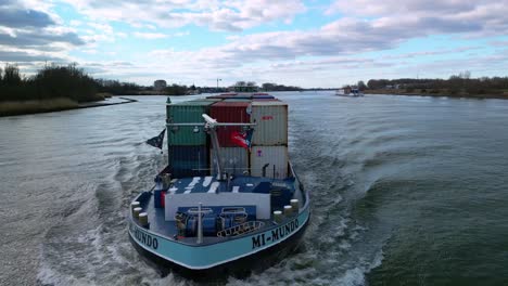 Spectacular-aerial-drone-shot-of-cargo-ship-Mi-Mundo,-near-Zwijndrecht,-Rotterdam-harbour-transport