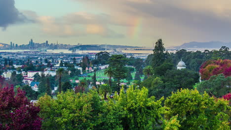 San-Francisco-skyline-and-suburbs-with-rainbow,-fusion-time-lapse-view