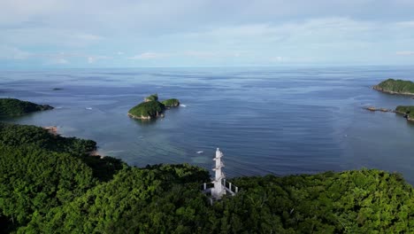 Aerial-Orbit-of-Bote-Lighthouse-with-Ocean-and-Islands-in-Distance,-Catanduanes,-Philippines