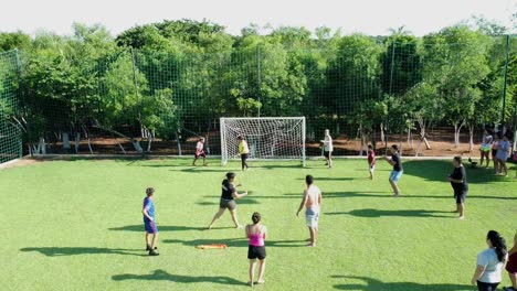Young-People-In-Mixed-Football-Match-In-Summer-House-In-Paraguay,-Penalty-Kick-Shot