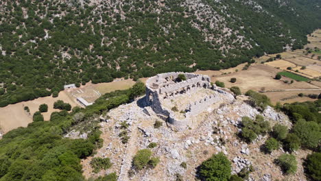 Aerial-circling-of-Turkish-fortress-ruins-on-sunny-day,-Askyfou-Plateau,-Crete