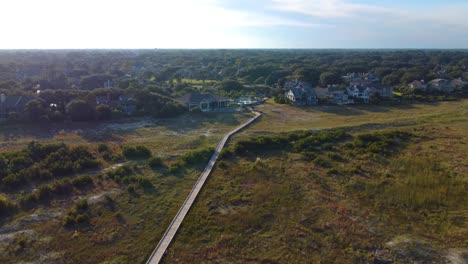 A-drone-shot-showing-off-a-boardwalk-over-dunes-on-Hilton-Head-Island