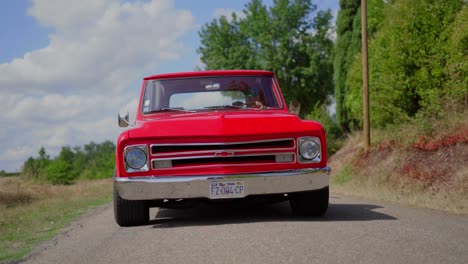 Chevrolet-C10-Car-Rolling-shot,-on-country-road-during-sunny-day