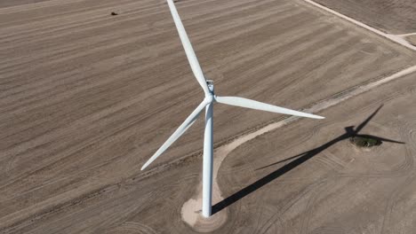Aerial-drone-shot-of-wind-turbines-spinning