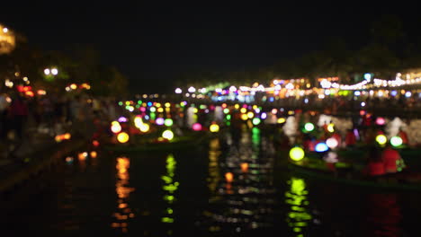 Out-of-focus-shot-of-vibrant-lanterns-on-small-wooden-boats-in-Hoi-An