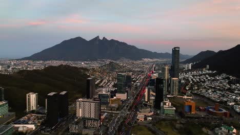 Aerial-view-around-skyscrapers-in-San-Pedro-Garza-Garcia,-evening-in-Monterrey,-Mexico