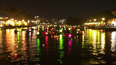 Timelapse-shot-of-vibrant-lantern-boats-traveling-in-the-river-in-Hoi-An