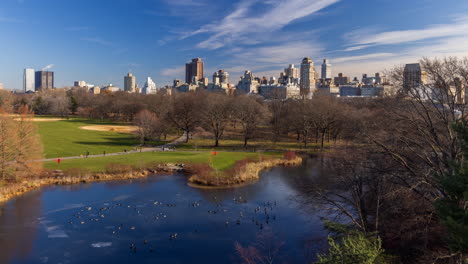 Timelapse-of-Central-Park-and-Turtle-Pond-with-New-York-City-skyline-in-the-background-on-a-cloudy-day