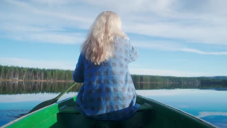 Person-in-a-canoe-paddling-on-a-lake-in-the-sun