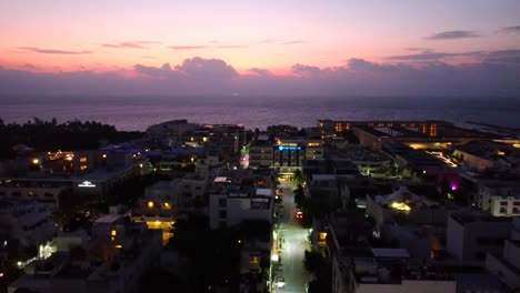 Crane-Shot-Of-Playa-Del-Carmen-Beautiful-Waterfront-After-Sunset,-Mexico
