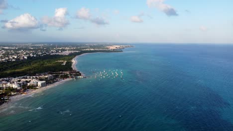 Aerial-Shot-Of-Playa-Del-Carmen-Magnificent-Seafront-Under-Cloudy-Blue-Sky,-Mexico