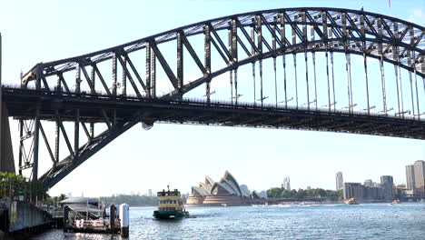 Sydney-ferry-slowly-approaches-Milsons-Point-wharf-in-Sydney-Harbour-Australia