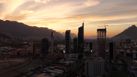 Skyscrapers-in-San-Pedro-Garza-Garcia,-Monterrey,-colorful-dusk-in-Mexico---Aerial-view