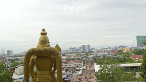 Back-view-of-Lord-Murugan-statue-during-Thaipusam-festival-at-Batu-Caves-Kuala-Lumpur-Malaysia-tilt-shot