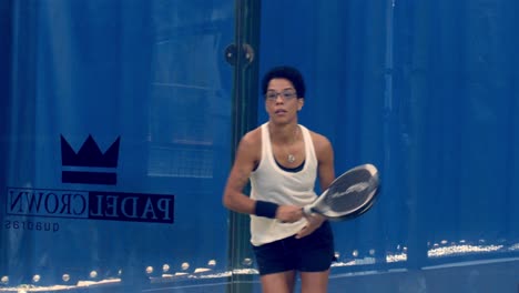 Close-up-of-young-black-woman-playing-padel-returning-balls-in-slow-motion