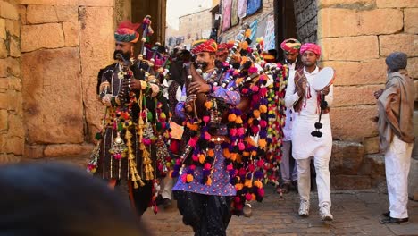 Few-bagpipers-walk-in-front-of-the-heritage-ceremonial-walk-in-the-Desert-Festival