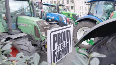 Farmers-protesting-against-measures-to-cut-down-nitrogen-emissions-with-sign-"Proud-to-be-a-Farmer"---Brussels,-Belgium