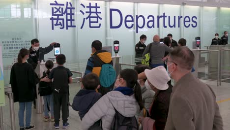 Family-relatives-give-their-last-goodbyes-before-passengers-go-through-the-departure-hall-at-the-international-airport-in-Hong-Kong