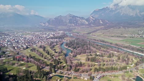 Aerial-View-Of-Golf-Club-Bad-Ragaz-In-Switzerland-With-Mountains-In-Distant-Background