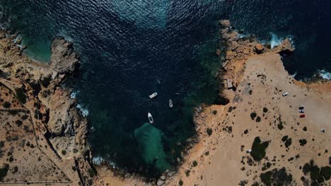 Top-aerial-view-over-the-coast-of-Ibiza,-Spain