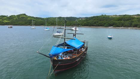 Drone-shot-view-of-tourist-pirate-ship,-Cenital,-Costa-Rica,-sea-transport-4K