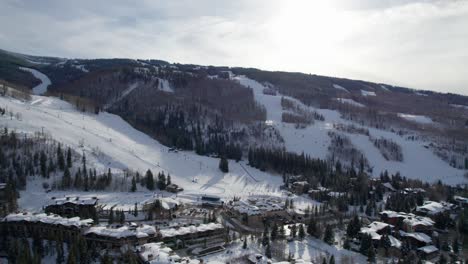 Drone-aerial-shot-of-a-large-ski-village-in-Colorado-during-winter