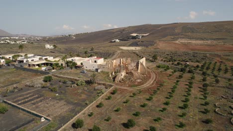 Aerial-over-fields-and-residential-houses-at-Lanzarote,-Canary-Islands,-Spain