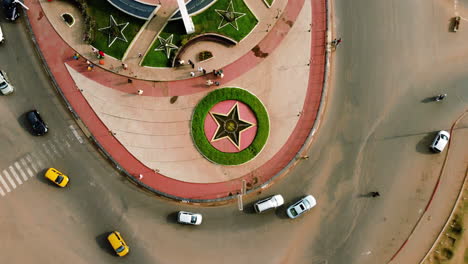 Aerial-view-over-the-Prime-Ministerial-Roundabout,-in-sunny-Yaounde-city,-Cameroon---top-down,-drone-shot
