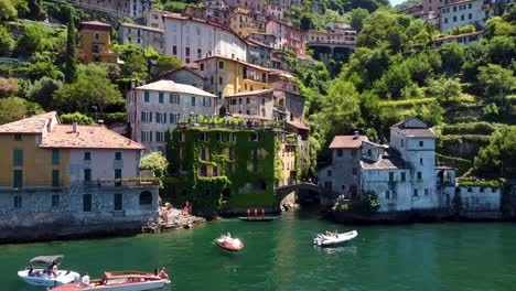 Ascending-shot-of-beautiful-houses-located-on-hillside-of-Lake-Como-in-Italy