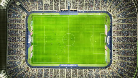 Aerial-view-above-the-Estadio-BBVA-stadium,-during-game-night-in-Monterrey,-Mexico---top-down,-drone-shot